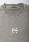 Gray t-shirt with a white logo on a light gray background